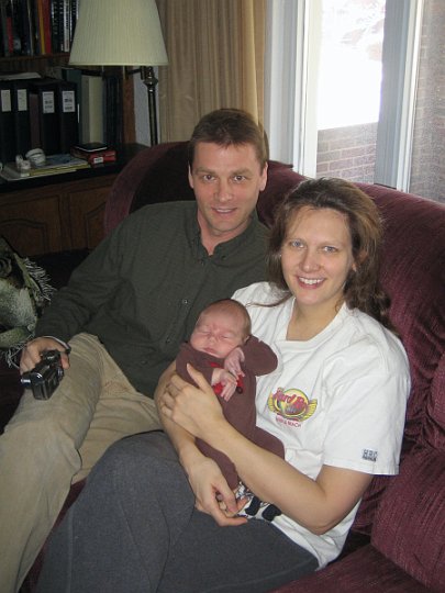 Alex and mom and dad.jpg - The whole family relaxing at home.